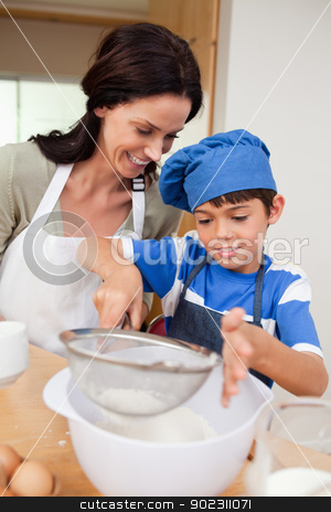 To use this stock image in your creative project, please select the size you need over to the right and click the "Add to Cart" button.
Your downloaded image will come with the Cutcaster watermark removed so don’t worry about the watermark you see on this page. Mother and son baking stock photo, Mother and son baking together by Wavebreak Media