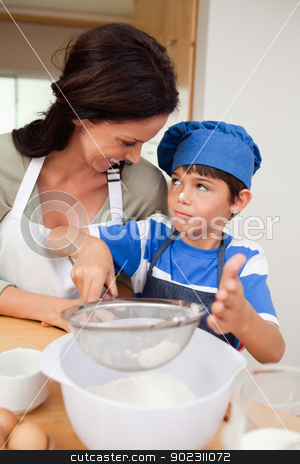 To use this stock image in your creative project, please select the size you need over to the right and click the "Add to Cart" button.
Your downloaded image will come with the Cutcaster watermark removed so don’t worry about the watermark you see on this page. Son and mother baking stock photo, Son and mother baking together by Wavebreak Media