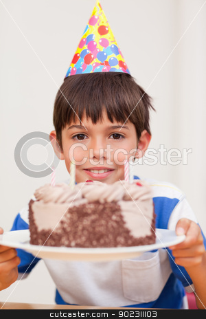 To use this stock image in your creative project, please select the size you need over to the right and click the "Add to Cart" button.
Your downloaded image will come with the Cutcaster watermark removed so don’t worry about the watermark you see on this page. Boy presenting birthday cake stock photo, Smiling boy presenting birthday cake by Wavebreak Media