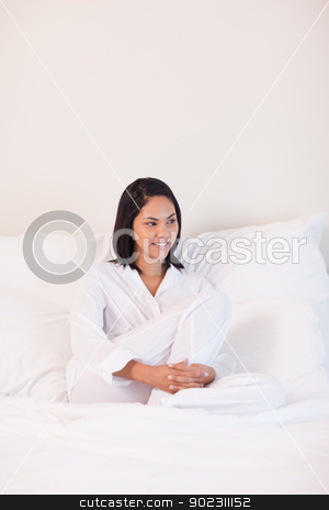 To use this stock image in your creative project, please select the size you need over to the right and click the "Add to Cart" button.
Your downloaded image will come with the Cutcaster watermark removed so don’t worry about the watermark you see on this page. Woman in pajamas sitting on the bed stock photo, Young woman in pajamas sitting on the bed by Wavebreak Media