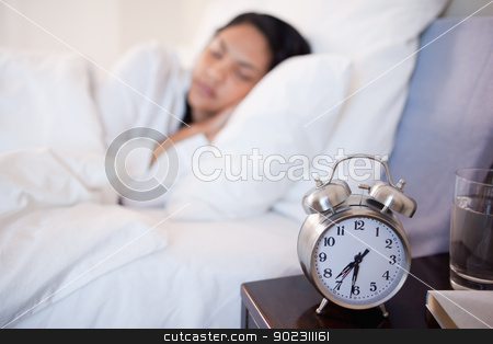 To use this stock image in your creative project, please select the size you need over to the right and click the "Add to Cart" button.
Your downloaded image will come with the Cutcaster watermark removed so don’t worry about the watermark you see on this page. Alarm clock next to woman sleeping in her bed stock photo, Alarm clock next to young woman sleeping in her bed by Wavebreak Media