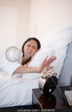 To use this stock image in your creative project, please select the size you need over to the right and click the "Add to Cart" button.
Your downloaded image will come with the Cutcaster watermark removed so don’t worry about the watermark you see on this page. Alarm clock being deactivated by woman stock photo, Alarm clock being deactivated by young woman by Wavebreak Media