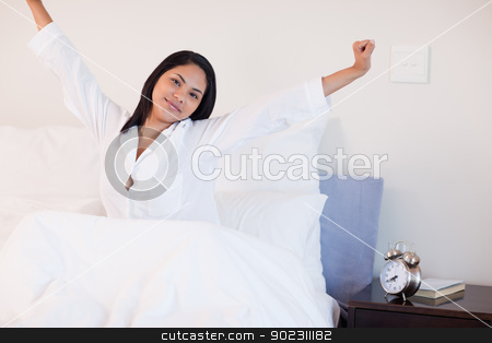 To use this stock image in your creative project, please select the size you need over to the right and click the "Add to Cart" button.
Your downloaded image will come with the Cutcaster watermark removed so don’t worry about the watermark you see on this page. Woman stretching on her bed to wake up stock photo, Young woman stretching on her bed to wake up by Wavebreak Media
