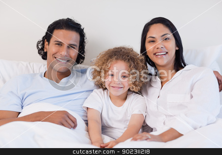 To use this stock image in your creative project, please select the size you need over to the right and click the "Add to Cart" button.
Your downloaded image will come with the Cutcaster watermark removed so don’t worry about the watermark you see on this page. Happy family sitting on the bed together stock photo, Happy young family sitting on the bed together by Wavebreak Media