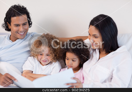 To use this stock image in your creative project, please select the size you need over to the right and click the "Add to Cart" button.
Your downloaded image will come with the Cutcaster watermark removed so don’t worry about the watermark you see on this page. Happy family enjoys reading a story together stock photo, Happy young family enjoys reading a story together by Wavebreak Media