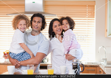 To use this stock image in your creative project, please select the size you need over to the right and click the "Add to Cart" button.
Your downloaded image will come with the Cutcaster watermark removed so don’t worry about the watermark you see on this page. Family having breakfast in the kitchen together stock photo, Young family having breakfast in the kitchen together by Wavebreak Media