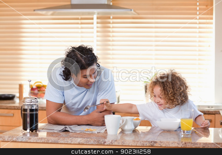 To use this stock image in your creative project, please select the size you need over to the right and click the "Add to Cart" button.
Your downloaded image will come with the Cutcaster watermark removed so don’t worry about the watermark you see on this page. Father and daughter having breakfast in the kitchen together stock photo, Young father and daughter having breakfast in the kitchen together by Wavebreak Media