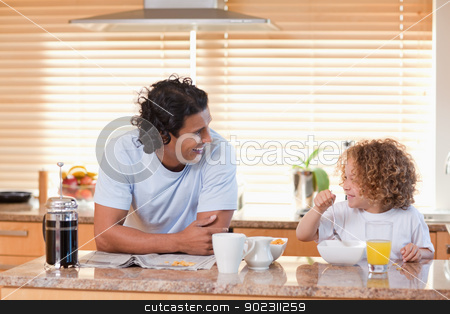 To use this stock image in your creative project, please select the size you need over to the right and click the "Add to Cart" button.
Your downloaded image will come with the Cutcaster watermark removed so don’t worry about the watermark you see on this page. Father and daughter having breakfast in the kitchen stock photo, Young father and daughter having breakfast in the kitchen by Wavebreak Media
