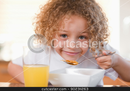 To use this stock image in your creative project, please select the size you need over to the right and click the "Add to Cart" button.
Your downloaded image will come with the Cutcaster watermark removed so don’t worry about the watermark you see on this page. Smiling girl having breakfast stock photo, Smiling young girl having breakfast by Wavebreak Media