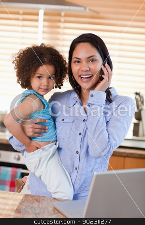 To use this stock image in your creative project, please select the size you need over to the right and click the "Add to Cart" button.
Your downloaded image will come with the Cutcaster watermark removed so don’t worry about the watermark you see on this page. Mother and daughter using cellphone in the kitchen together stock photo, Young mother and daughter using cellphone in the kitchen together by Wavebreak Media