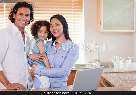 To use this stock image in your creative project, please select the size you need over to the right and click the "Add to Cart" button.
Your downloaded image will come with the Cutcaster watermark removed so don’t worry about the watermark you see on this page. Family surfing the web in the kitchen together stock photo, Young family surfing the web in the kitchen together by Wavebreak Media