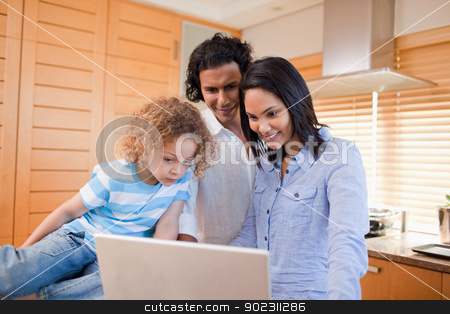 To use this stock image in your creative project, please select the size you need over to the right and click the "Add to Cart" button.
Your downloaded image will come with the Cutcaster watermark removed so don’t worry about the watermark you see on this page. Happy family surfing the internet in the kitchen together stock photo, Happy young family surfing the internet in the kitchen together by Wavebreak Media