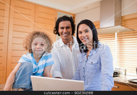 To use this stock image in your creative project, please select the size you need over to the right and click the "Add to Cart" button.
Your downloaded image will come with the Cutcaster watermark removed so don’t worry about the watermark you see on this page. Joyful family surfing the internet in the kitchen together stock photo, Joyful young family surfing the internet in the kitchen together by Wavebreak Media