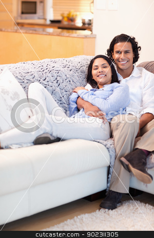 To use this stock image in your creative project, please select the size you need over to the right and click the "Add to Cart" button.
Your downloaded image will come with the Cutcaster watermark removed so don’t worry about the watermark you see on this page. Happy couple relaxing on the couch together stock photo, Happy young couple relaxing on the couch together by Wavebreak Media