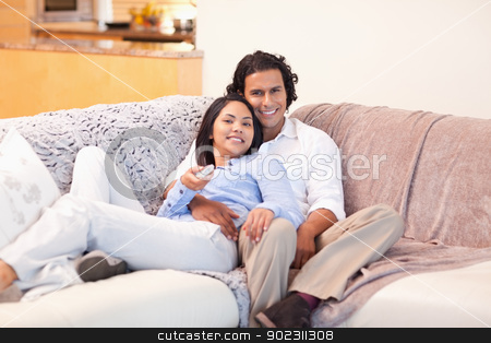 To use this stock image in your creative project, please select the size you need over to the right and click the "Add to Cart" button.
Your downloaded image will come with the Cutcaster watermark removed so don’t worry about the watermark you see on this page. Couple watching television together stock photo, Young couple watching television together by Wavebreak Media