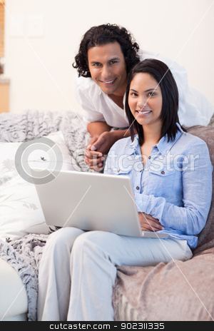 To use this stock image in your creative project, please select the size you need over to the right and click the "Add to Cart" button.
Your downloaded image will come with the Cutcaster watermark removed so don’t worry about the watermark you see on this page. Couple surfing the internet on the couch stock photo, Young couple surfing the internet on the couch by Wavebreak Media