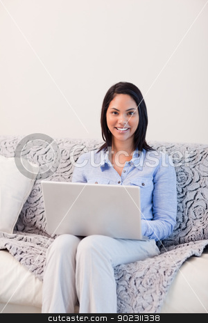 To use this stock image in your creative project, please select the size you need over to the right and click the "Add to Cart" button.
Your downloaded image will come with the Cutcaster watermark removed so don’t worry about the watermark you see on this page. Smiling woman on the sofa surfing the internet stock photo, Smiling young woman on the sofa surfing the internet by Wavebreak Media