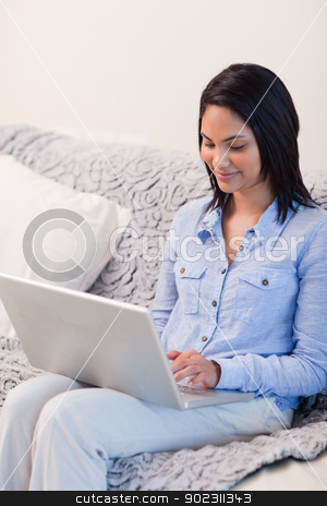 To use this stock image in your creative project, please select the size you need over to the right and click the "Add to Cart" button.
Your downloaded image will come with the Cutcaster watermark removed so don’t worry about the watermark you see on this page. Smiling woman on the sofa with her notebook stock photo, Smiling young woman on the sofa with her notebook by Wavebreak Media