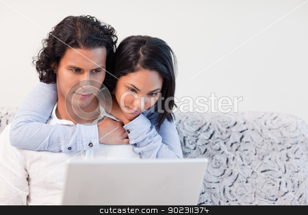 To use this stock image in your creative project, please select the size you need over to the right and click the "Add to Cart" button.
Your downloaded image will come with the Cutcaster watermark removed so don’t worry about the watermark you see on this page. Woman hugging her boyfriend that is working on his notebook stock photo, Young woman hugging her boyfriend that is working on his notebook by Wavebreak Media