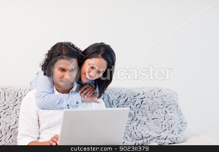 To use this stock image in your creative project, please select the size you need over to the right and click the "Add to Cart" button.
Your downloaded image will come with the Cutcaster watermark removed so don’t worry about the watermark you see on this page. Couple spending time online stock photo, Young couple spending time online by Wavebreak Media