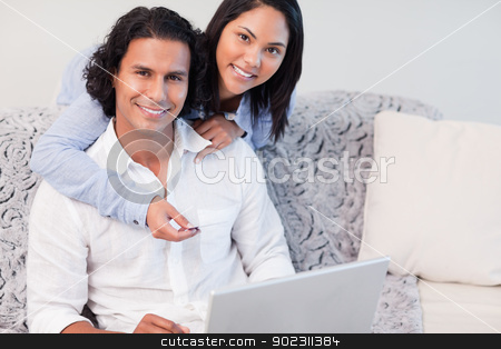 To use this stock image in your creative project, please select the size you need over to the right and click the "Add to Cart" button.
Your downloaded image will come with the Cutcaster watermark removed so don’t worry about the watermark you see on this page. Couple shopping online together stock photo, Young couple shopping online together by Wavebreak Media