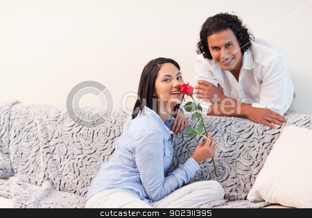 To use this stock image in your creative project, please select the size you need over to the right and click the "Add to Cart" button.
Your downloaded image will come with the Cutcaster watermark removed so don’t worry about the watermark you see on this page. Couple in the living room together on valentines day stock photo, Young couple in the living room together on valentines day by Wavebreak Media