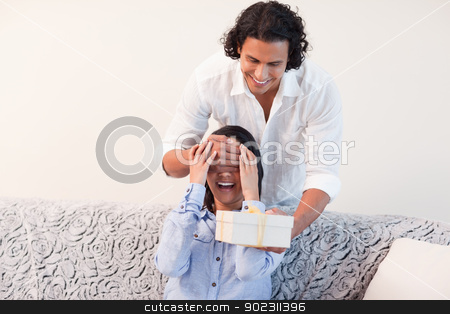 To use this stock image in your creative project, please select the size you need over to the right and click the "Add to Cart" button.
Your downloaded image will come with the Cutcaster watermark removed so don’t worry about the watermark you see on this page. Man having a present for his girlfriend stock photo, Young man having a present for his girlfriend by Wavebreak Media