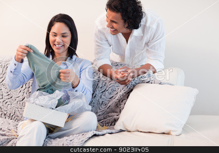 To use this stock image in your creative project, please select the size you need over to the right and click the "Add to Cart" button.
Your downloaded image will come with the Cutcaster watermark removed so don’t worry about the watermark you see on this page. Woman just opened the present she got from her boyfriend stock photo, Young woman just opened the present she got from her boyfriend by Wavebreak Media