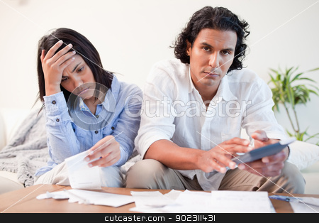 To use this stock image in your creative project, please select the size you need over to the right and click the "Add to Cart" button.
Your downloaded image will come with the Cutcaster watermark removed so don’t worry about the watermark you see on this page. Frustrated couple checking their bills in the living room stock photo, Frustrated young couple checking their bills in the living room by Wavebreak Media