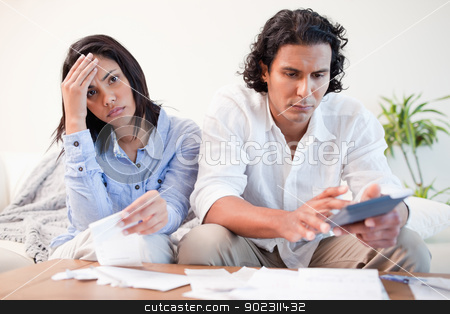To use this stock image in your creative project, please select the size you need over to the right and click the "Add to Cart" button.
Your downloaded image will come with the Cutcaster watermark removed so don’t worry about the watermark you see on this page. Frustrated couple doing their calculations in the living room stock photo, Frustrated young couple doing their calculations in the living room by Wavebreak Media