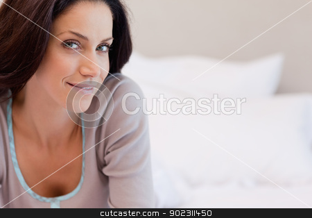 To use this stock image in your creative project, please select the size you need over to the right and click the "Add to Cart" button.
Your downloaded image will come with the Cutcaster watermark removed so don’t worry about the watermark you see on this page. Woman lying on the bed stock photo, Smiling woman lying on the bed by Wavebreak Media
