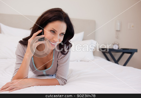 To use this stock image in your creative project, please select the size you need over to the right and click the "Add to Cart" button.
Your downloaded image will come with the Cutcaster watermark removed so don’t worry about the watermark you see on this page. Woman laying on the bed having a phone call stock photo, Young woman laying on the bed having a phone call by Wavebreak Media