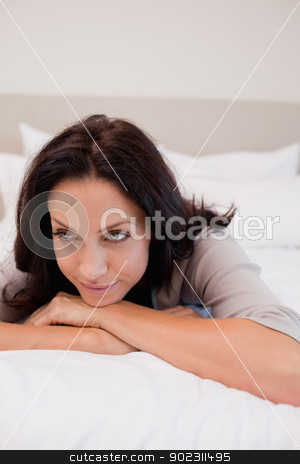 To use this stock image in your creative project, please select the size you need over to the right and click the "Add to Cart" button.
Your downloaded image will come with the Cutcaster watermark removed so don’t worry about the watermark you see on this page. Thoughtful woman on the bed stock photo, Thoughtful young woman on the bed by Wavebreak Media