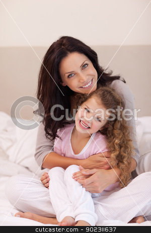 To use this stock image in your creative project, please select the size you need over to the right and click the "Add to Cart" button.
Your downloaded image will come with the Cutcaster watermark removed so don’t worry about the watermark you see on this page. Mother hugging her daughter stock photo, Young mother hugging her daughter by Wavebreak Media