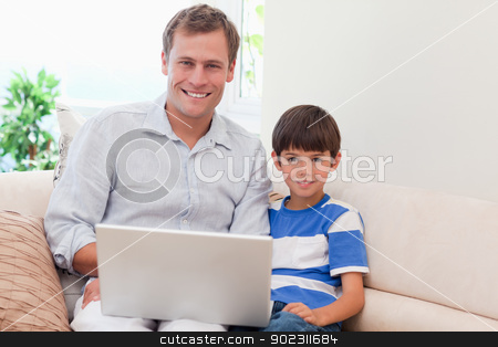 To use this stock image in your creative project, please select the size you need over to the right and click the "Add to Cart" button.
Your downloaded image will come with the Cutcaster watermark removed so don’t worry about the watermark you see on this page. Father and son with laptop on the sofa stock photo, Young father and son with laptop on the sofa by Wavebreak Media