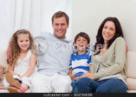 To use this stock image in your creative project, please select the size you need over to the right and click the "Add to Cart" button.
Your downloaded image will come with the Cutcaster watermark removed so don’t worry about the watermark you see on this page. Family sitting on the couch together stock photo, Young family sitting on the couch together by Wavebreak Media