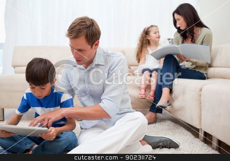 To use this stock image in your creative project, please select the size you need over to the right and click the "Add to Cart" button.
Your downloaded image will come with the Cutcaster watermark removed so don’t worry about the watermark you see on this page. Family spending spare time in the living room stock photo, Young family spending spare time in the living room by Wavebreak Media