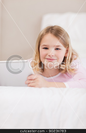 To use this stock image in your creative project, please select the size you need over to the right and click the "Add to Cart" button.
Your downloaded image will come with the Cutcaster watermark removed so don’t worry about the watermark you see on this page. Portrait of a cute little girl using a tablet computer stock photo, Portrait of a cute little girl using a tablet computer in a bedroom by Wavebreak Media