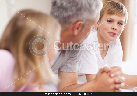 To use this stock image in your creative project, please select the size you need over to the right and click the "Add to Cart" button.
Your downloaded image will come with the Cutcaster watermark removed so don’t worry about the watermark you see on this page. Father having a discussion with his children stock photo, Father having a discussion with his children in a bedroom by Wavebreak Media