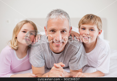 To use this stock image in your creative project, please select the size you need over to the right and click the "Add to Cart" button.
Your downloaded image will come with the Cutcaster watermark removed so don’t worry about the watermark you see on this page. Cute siblings and their father posing stock photo, Cute siblings and their father posing in a bedroom by Wavebreak Media