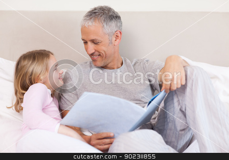 To use this stock image in your creative project, please select the size you need over to the right and click the "Add to Cart" button.
Your downloaded image will come with the Cutcaster watermark removed so don’t worry about the watermark you see on this page. Happy father reading a story to his daughter stock photo, Happy father reading a story to his daughter in a bedroom by Wavebreak Media
