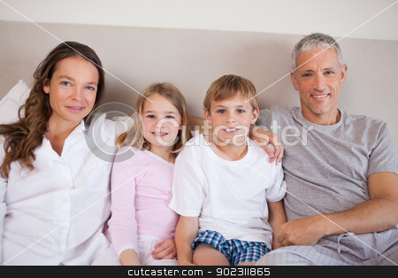 To use this stock image in your creative project, please select the size you need over to the right and click the "Add to Cart" button.
Your downloaded image will come with the Cutcaster watermark removed so don’t worry about the watermark you see on this page. Happy family lying on a bed stock photo, Happy family lying on a bed while looking at the camera by Wavebreak Media