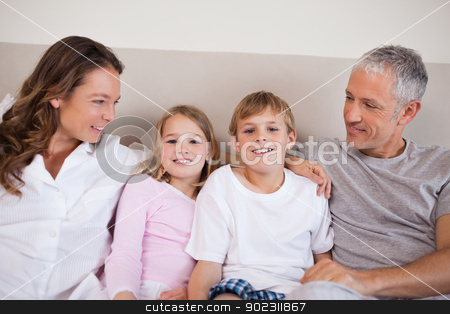 To use this stock image in your creative project, please select the size you need over to the right and click the "Add to Cart" button.
Your downloaded image will come with the Cutcaster watermark removed so don’t worry about the watermark you see on this page. Good looking family lying on a bed stock photo, Good looking family lying on a bed in the morning by Wavebreak Media