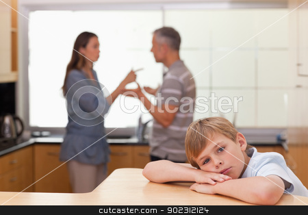 To use this stock image in your creative project, please select the size you need over to the right and click the "Add to Cart" button.
Your downloaded image will come with the Cutcaster watermark removed so don’t worry about the watermark you see on this page. Sad little boy hearing his parents arguing stock photo, Sad little boy hearing his parents arguing in a kitchen by Wavebreak Media