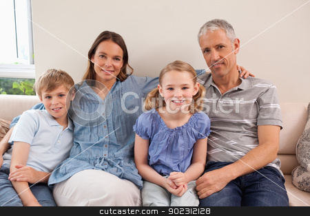 To use this stock image in your creative project, please select the size you need over to the right and click the "Add to Cart" button.
Your downloaded image will come with the Cutcaster watermark removed so don’t worry about the watermark you see on this page. Happy family sitting on a sofa stock photo, Happy family sitting on a sofa looking at the camera by Wavebreak Media