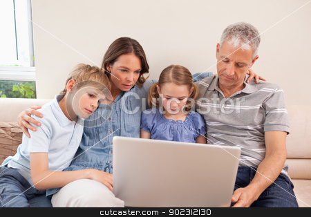 To use this stock image in your creative project, please select the size you need over to the right and click the "Add to Cart" button.
Your downloaded image will come with the Cutcaster watermark removed so don’t worry about the watermark you see on this page. Family sitting on a sofa using a laptop stock photo, Family sitting on a sofa using a laptop in a living room by Wavebreak Media