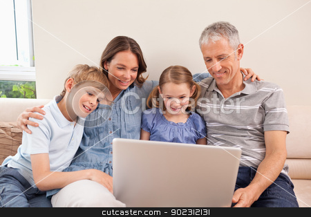 To use this stock image in your creative project, please select the size you need over to the right and click the "Add to Cart" button.
Your downloaded image will come with the Cutcaster watermark removed so don’t worry about the watermark you see on this page. Family sitting on a sofa using a notebook stock photo, Family sitting on a sofa using a notebook in a living room by Wavebreak Media