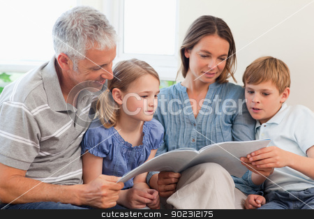 To use this stock image in your creative project, please select the size you need over to the right and click the "Add to Cart" button.
Your downloaded image will come with the Cutcaster watermark removed so don’t worry about the watermark you see on this page. Family reading a book together stock photo, Family reading a book together in a living room by Wavebreak Media