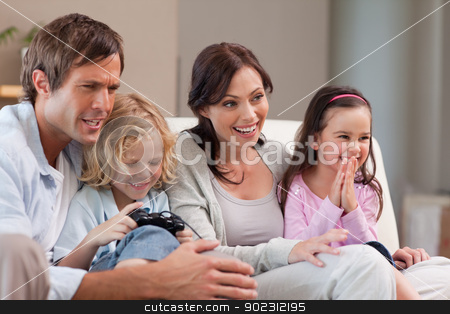 To use this stock image in your creative project, please select the size you need over to the right and click the "Add to Cart" button.
Your downloaded image will come with the Cutcaster watermark removed so don’t worry about the watermark you see on this page. Happy family playing video games together stock photo, Happy family playing video games together in a living room by Wavebreak Media