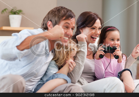 To use this stock image in your creative project, please select the size you need over to the right and click the "Add to Cart" button.
Your downloaded image will come with the Cutcaster watermark removed so don’t worry about the watermark you see on this page. Positive family playing video games together stock photo, Positive family playing video games together in a living room by Wavebreak Media